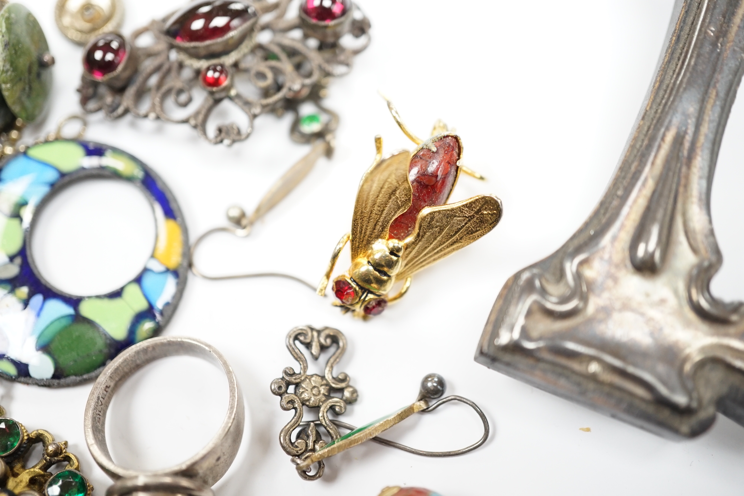An Art Nouveau style sterling and enamelled double photograph frame, width 11.3cm, together with sundry jewellery including an Austro-Hungarian style necklace, white metal and cabochon amethyst set ring(stamped silver) e